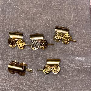 Vintage miniature metal covered wagon toy for a dollhouse.